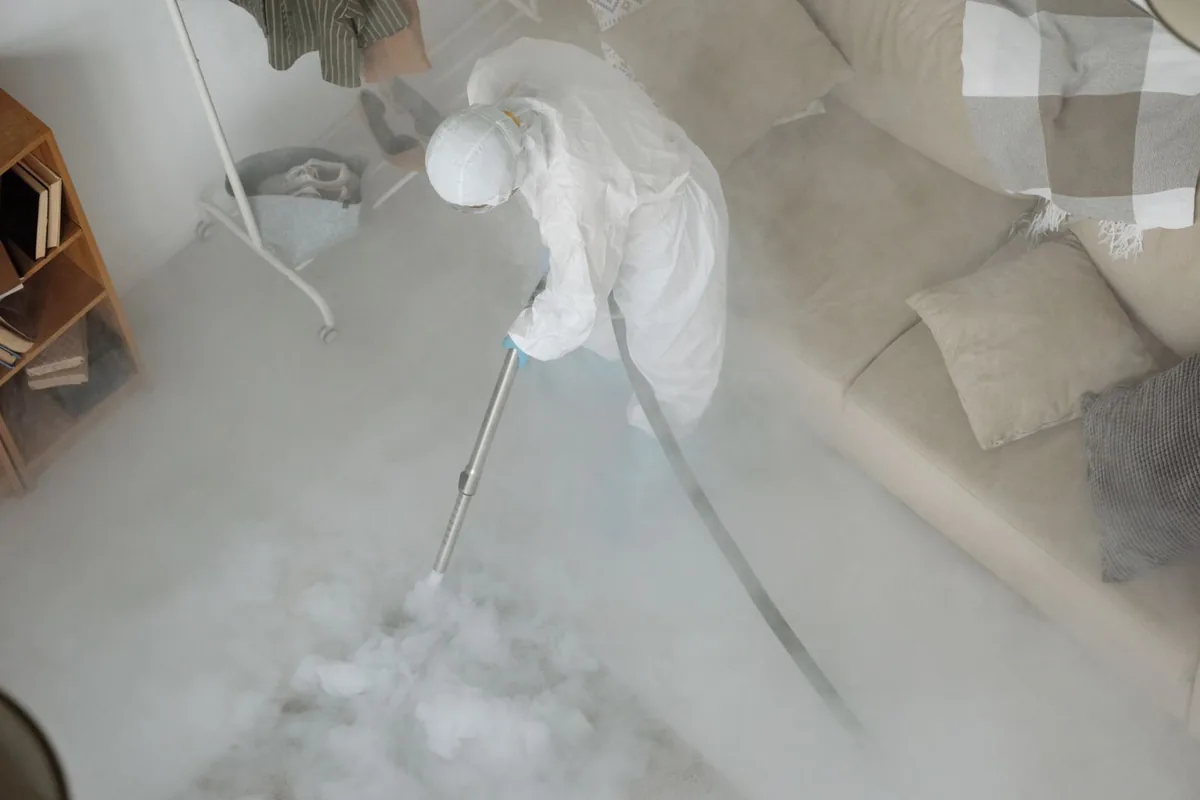 Biohazard cleanup technician in protective equipment, Rio Rancho Estates, NM